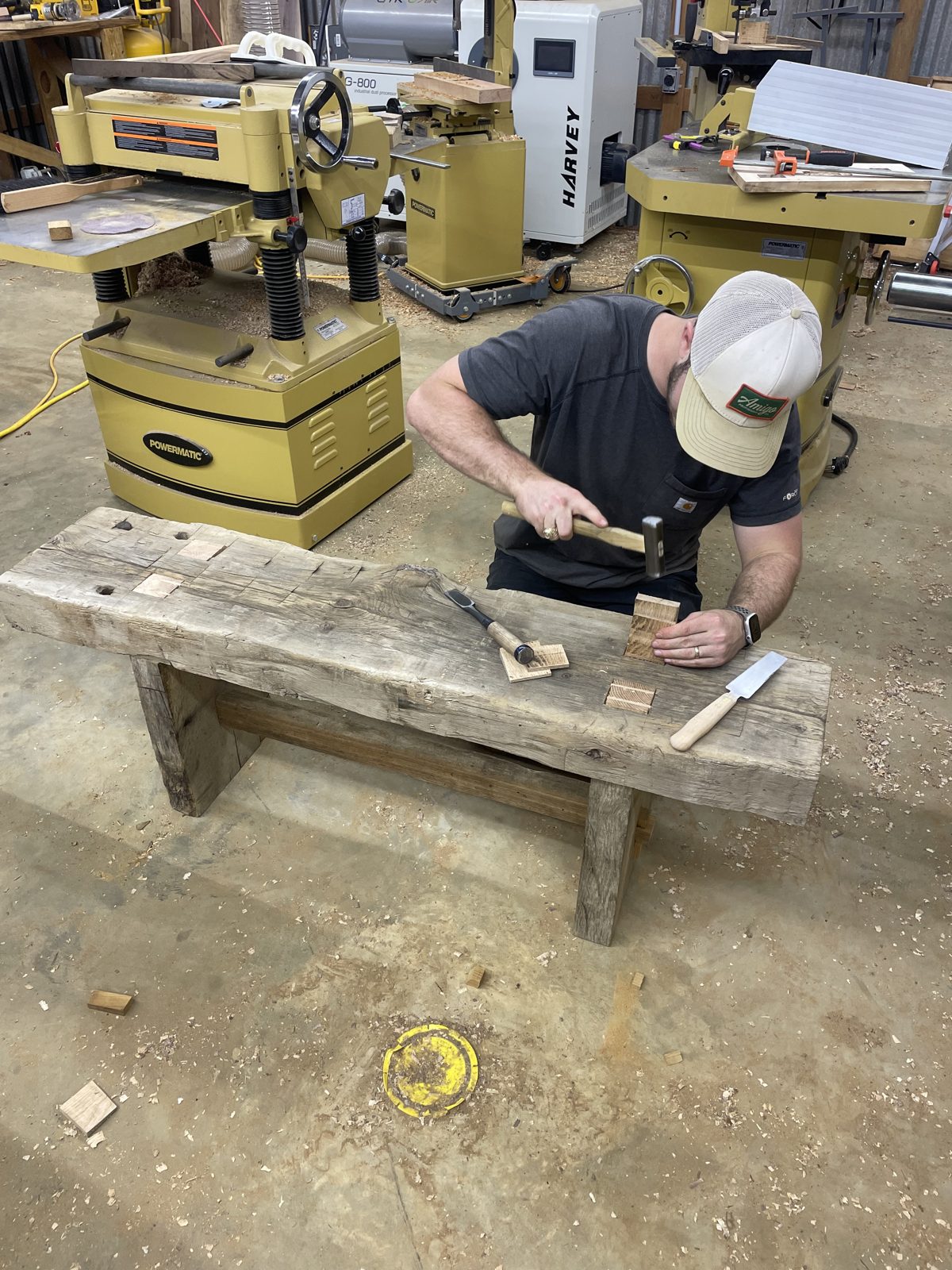 Fitting butterfly keys into a rustic timber bench top with a hammer and chisel