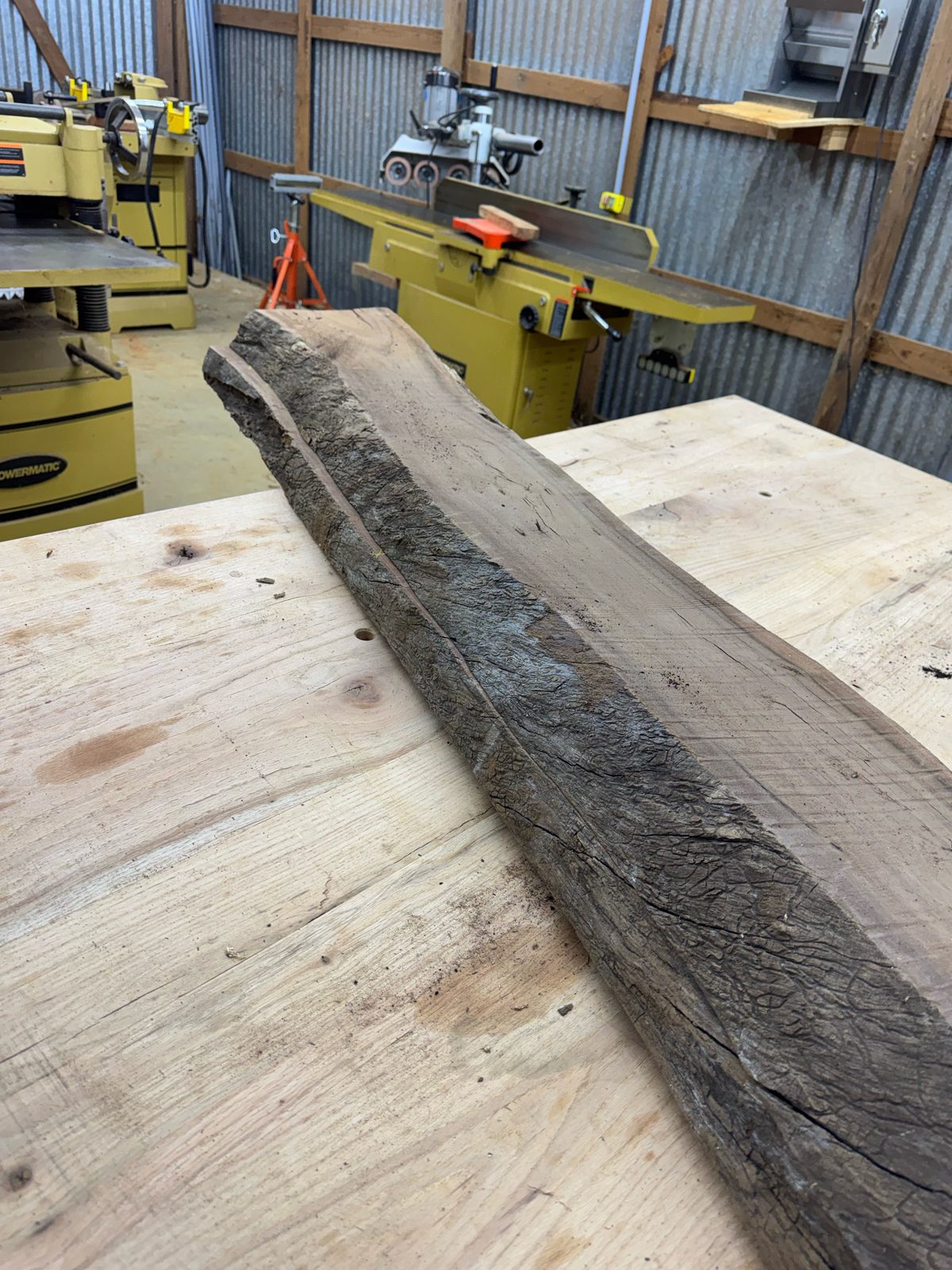 Black walnut bookmatch set, lot BW002, live edge on bench