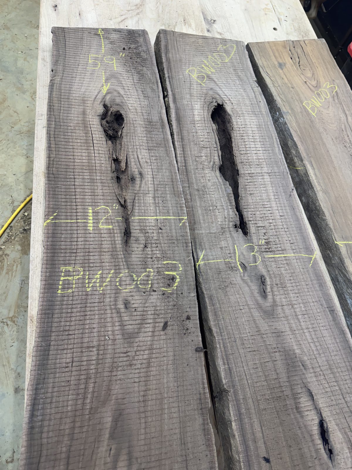 Three walnut slabs chalk-marked BW003 with sizes, lot BW003