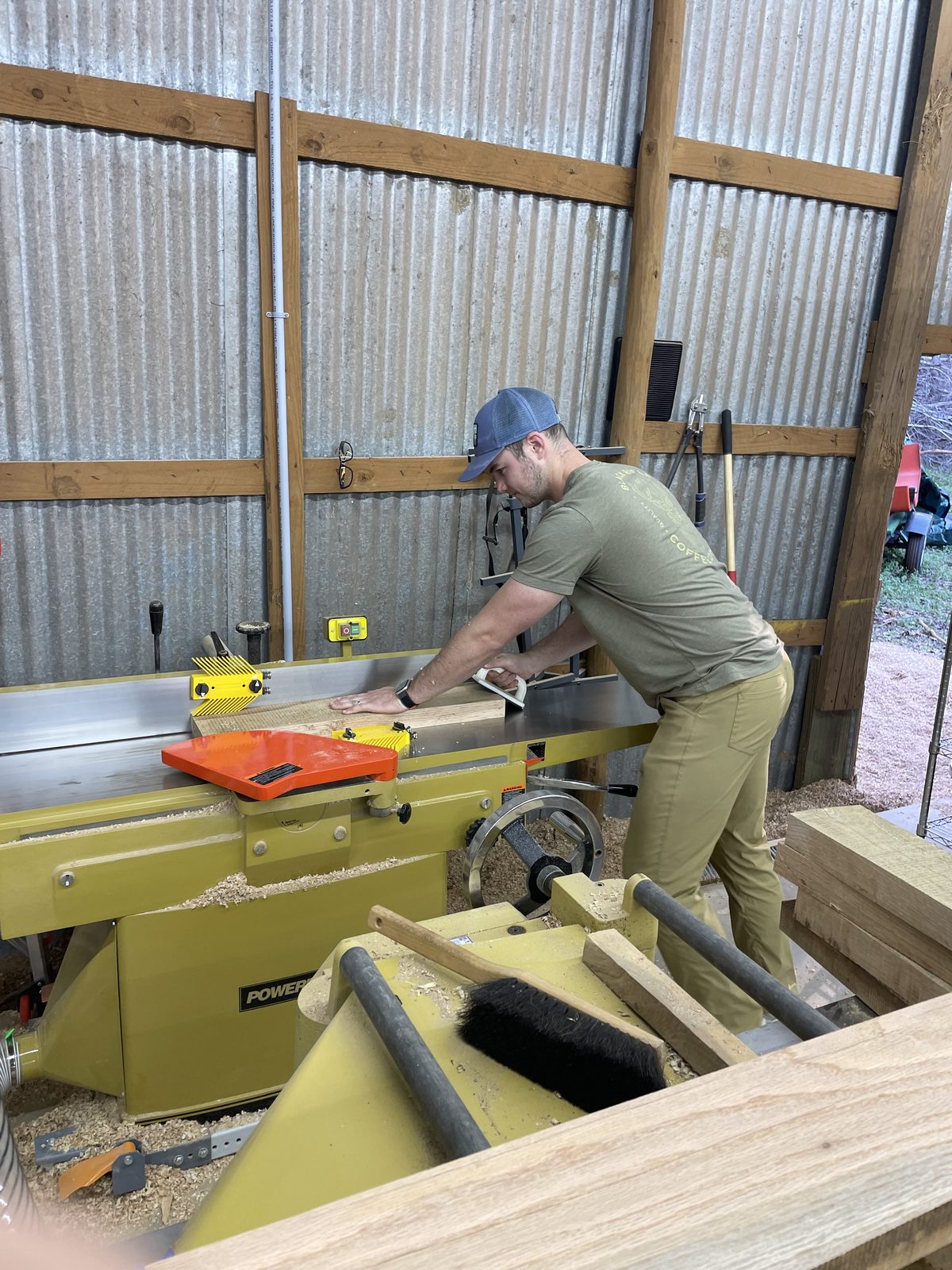 Jointing a board on a Powermatic jointer in the shop